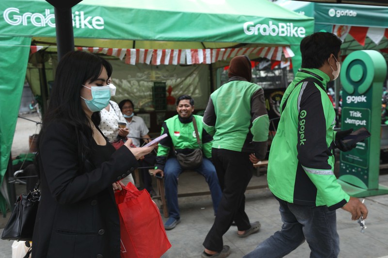 Ilustrasi aturan baru tarif ojek online. (CNBC Indonesia/Tri Susilo)