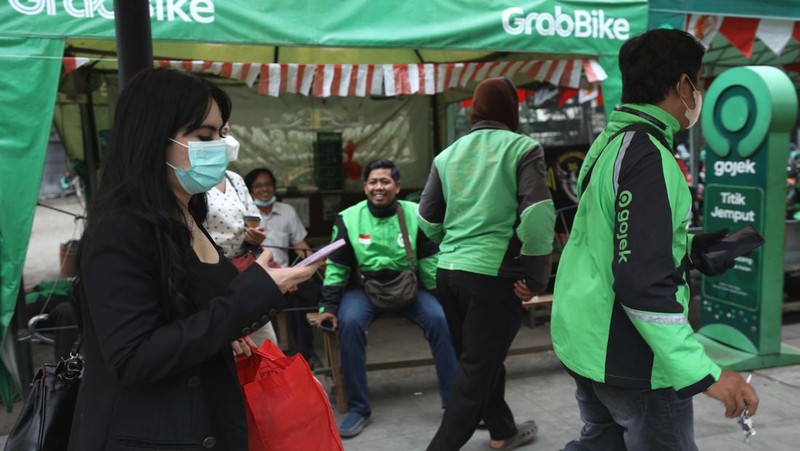 Ilustrasi aturan baru tarif ojek online. (CNBC Indonesia/Tri Susilo)