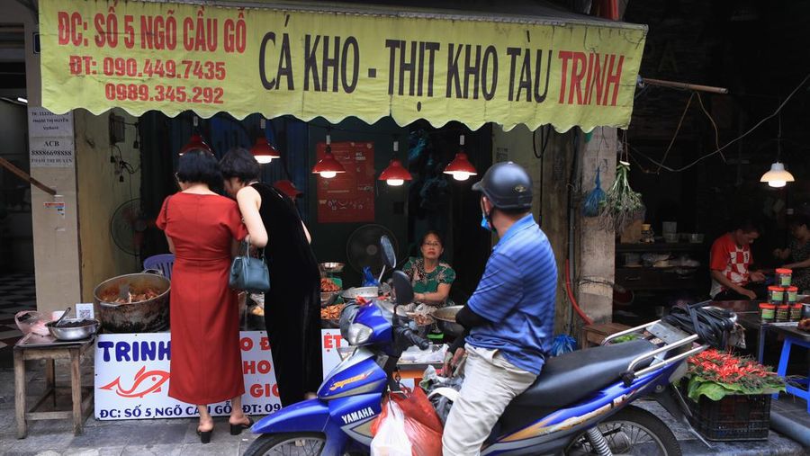 People shop for food in a market in Hanoi, Vietnam on Sunday, Aug. 14, 2022. In the six months since Russia invaded Ukraine, the fallout from the war has had huge effects on the global economy. Though intertwined with other forces, the war has made problems like inflation much worse for people around the world. Soaring food and energy prices have turned into crises that are threatening to plunge millions of people into poverty and make recessions ever more likely. (AP Photo/Hau Dinh)