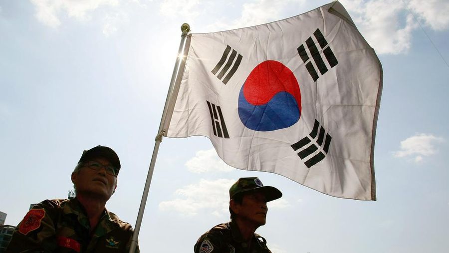 SEOUL, SOUTH KOREA - MAY 27: South Korean war veterans and conservative protesters hold an anti-North Korea rally in front of City Hall on May 27, 2010 in Seoul, South Korea. North Korea declared to cut all the ties with the South as a punishment for being blamed for the sinking of a South Korean warship. (Photo by Chung Sung-Jun/Getty Images)