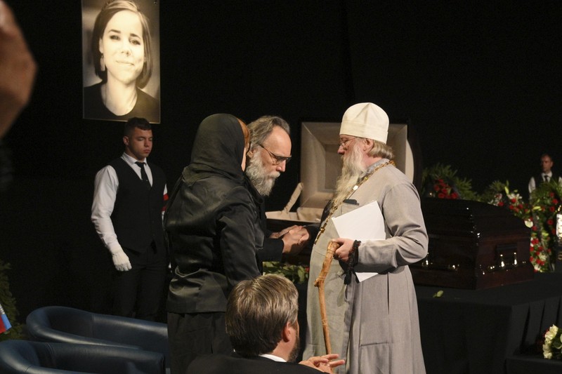 Philosopher Alexander Dugin speaks during the final farewell ceremony for his daughter Daria Dugina in Moscow, Russia, Tuesday, Aug. 23, 2022. Daria Dugina, a 29-year-old commentator with a nationalist Russian TV channel, died when a remotely controlled explosive device planted in her SUV blew up on Saturday night as she was driving on the outskirts of Moscow, ripping the vehicle apart and killing her on the spot, authorities said. (AP Photo/Dmitry Serebryakov)