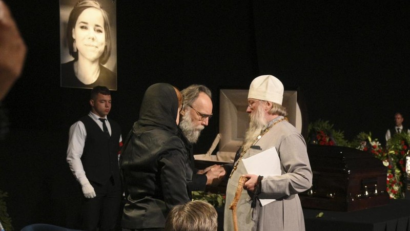 Philosopher Alexander Dugin speaks during the final farewell ceremony for his daughter Daria Dugina in Moscow, Russia, Tuesday, Aug. 23, 2022. Daria Dugina, a 29-year-old commentator with a nationalist Russian TV channel, died when a remotely controlled explosive device planted in her SUV blew up on Saturday night as she was driving on the outskirts of Moscow, ripping the vehicle apart and killing her on the spot, authorities said. (AP Photo/Dmitry Serebryakov)
