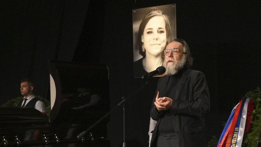 Philosopher Alexander Dugin speaks during the final farewell ceremony for his daughter Daria Dugina in Moscow, Russia, Tuesday, Aug. 23, 2022. Daria Dugina, a 29-year-old commentator with a nationalist Russian TV channel, died when a remotely controlled explosive device planted in her SUV blew up on Saturday night as she was driving on the outskirts of Moscow, ripping the vehicle apart and killing her on the spot, authorities said. (AP Photo/Dmitry Serebryakov)