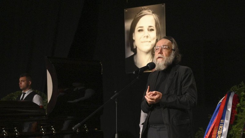 Philosopher Alexander Dugin speaks during the final farewell ceremony for his daughter Daria Dugina in Moscow, Russia, Tuesday, Aug. 23, 2022. Daria Dugina, a 29-year-old commentator with a nationalist Russian TV channel, died when a remotely controlled explosive device planted in her SUV blew up on Saturday night as she was driving on the outskirts of Moscow, ripping the vehicle apart and killing her on the spot, authorities said. (AP Photo/Dmitry Serebryakov)