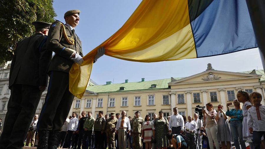 LVIV, UKRAINE - AUGUST 24: Dignitaries and members of the public attend a ceremony in the Na Valakh park on Independence Day of Ukraine on August 24, 2022 in Lviv, Ukraine. This year, Ukraine's Independence Day, commemorating its break with the Soviet Union in 1991, coincides with the six-month mark since Russia launched its large-scale invasion of the country. The fighting has largely focused on the eastern Donbas region and the south, but most anywhere in Ukraine remains vulnerable to Russian air strikes. (Photo by Jeff J Mitchell/Getty Images)