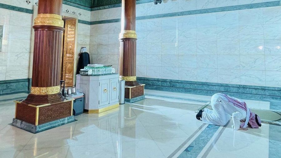 This picture taken on July 6, 2022 shows a close-up view of the Kiswa, the cloth used to cover the Kaaba, and the Kaaba's gold doors underneath, at the Grand Mosque in the Muslim holy city of Mecca during the annual Hajj pilgrimage. - One million fully vaccinated Muslims, including 850,000 from abroad, are allowed at this year's hajj in the city of Mecca, a big rise after two years of drastically curtailed numbers due to policies to stop the spread of infection. (Photo by AFP) (Photo by -/AFP via Getty Images)