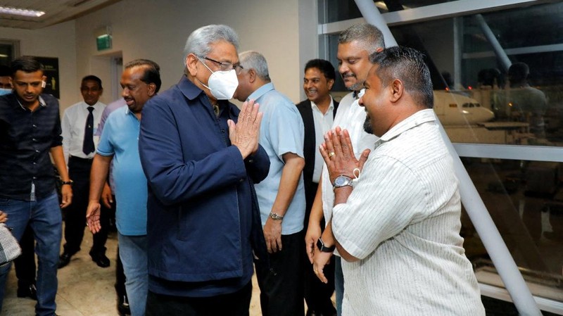 Sri Lanka's ousted President Gotabaya Rajapaksa's party members welcome him and his wife Ioma Rajapaksa at the Bandaranaike International Airport as he returns to the country after he had fled during the July economic unrest and protestors stormed in the president's house in Katunayake, Sri Lanka, September 2, 2022. PR Media Unit/Handout via Reuters NO RESALES. NO ARCHIVES THIS IMAGE HAS BEEN SUPPLIED BY A THIRD PARTY.