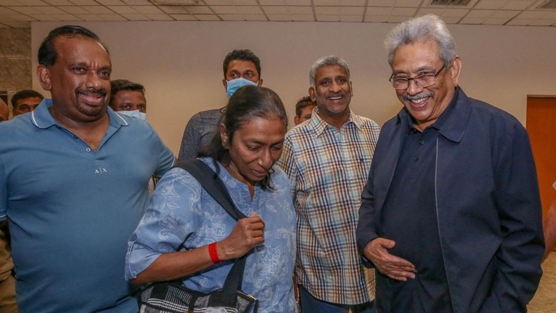 Sri Lanka's ousted President Gotabaya Rajapaksa's party members welcome him and his wife Ioma Rajapaksa at the Bandaranaike International Airport as he returns to the country after he had fled during the July economic unrest and protestors stormed in the president's house in Katunayake, Sri Lanka, September 2, 2022. PR Media Unit/Handout via Reuters NO RESALES. NO ARCHIVES THIS IMAGE HAS BEEN SUPPLIED BY A THIRD PARTY.