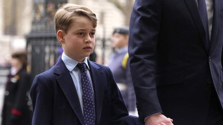 FILE - Britain's Prince George holds the hand of his father Prince William as they arrive to attend a Service of Thanksgiving for the life of Prince Philip, Duke of Edinburgh at Westminster Abbey in London, Tuesday, March 29, 2022. (AP Photo/Matt Dunham, File)