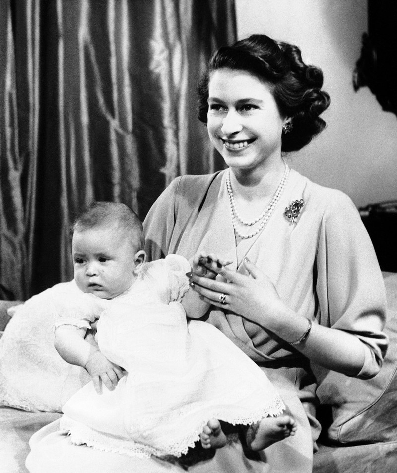 Britain Queen Elizabeth New King FILE - In this April 10, 1949 file photo, Prince Charles of Edinburgh, left, sits for a photo with his mother, Princess Elizabeth, in Buckingham Palace, London. Prince Charles has been preparing for the crown his entire life. Now, that moment has finally arrived. Charles, the oldest person to ever assume the British throne, became king on Thursday Sept. 8, 2022, following the death of his mother, Queen Elizabeth II. (AP Photo, File)