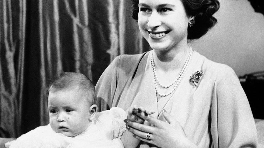 FILE - In this April 10, 1949 file photo, Prince Charles of Edinburgh, left, sits for a photo with his mother, Princess Elizabeth, in Buckingham Palace, London. Prince Charles has been preparing for the crown his entire life. Now, that moment has finally arrived. Charles, the oldest person to ever assume the British throne, became king on Thursday Sept. 8, 2022, following the death of his mother, Queen Elizabeth II. (AP Photo, File)