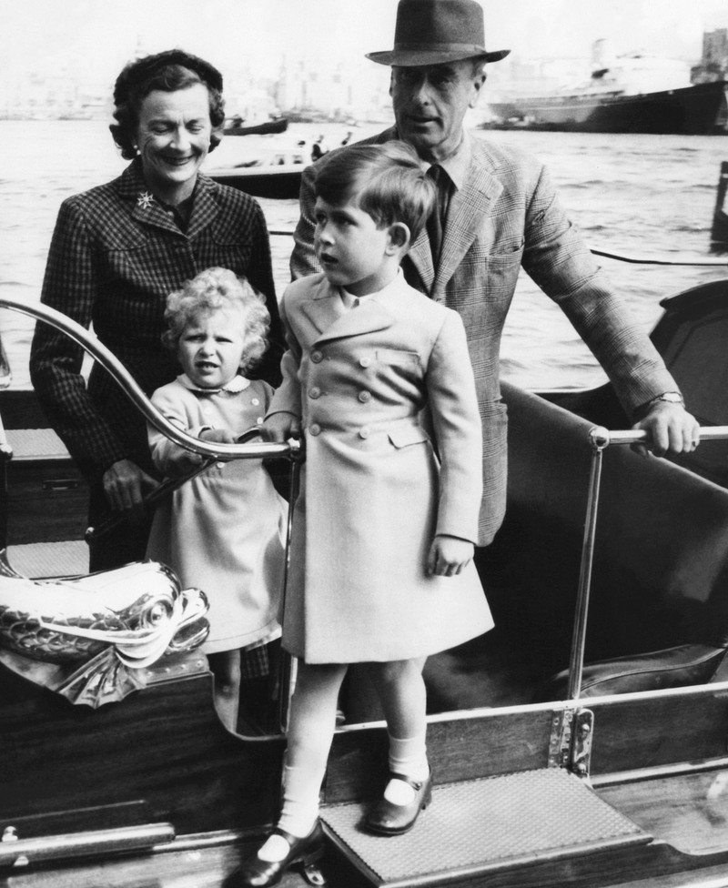 FILE - In this April 10, 1949 file photo, Prince Charles of Edinburgh, left, sits for a photo with his mother, Princess Elizabeth, in Buckingham Palace, London. Prince Charles has been preparing for the crown his entire life. Now, that moment has finally arrived. Charles, the oldest person to ever assume the British throne, became king on Thursday Sept. 8, 2022, following the death of his mother, Queen Elizabeth II. (AP Photo, File)