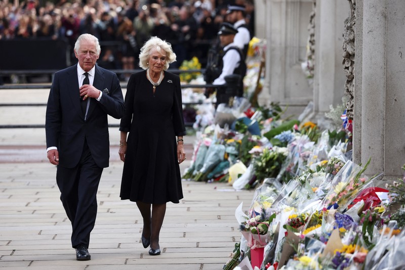 Britain's King Charles and Queen Camilla walk outside Buckingham Palace, following the passing of Britain's Queen Elizabeth, in London, Britain, September 9, 2022. REUTERS/Henry Nicholls