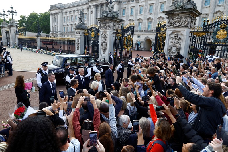 Britain's King Charles and Queen Camilla walk outside Buckingham Palace, following the passing of Britain's Queen Elizabeth, in London, Britain, September 9, 2022. REUTERS/Henry Nicholls