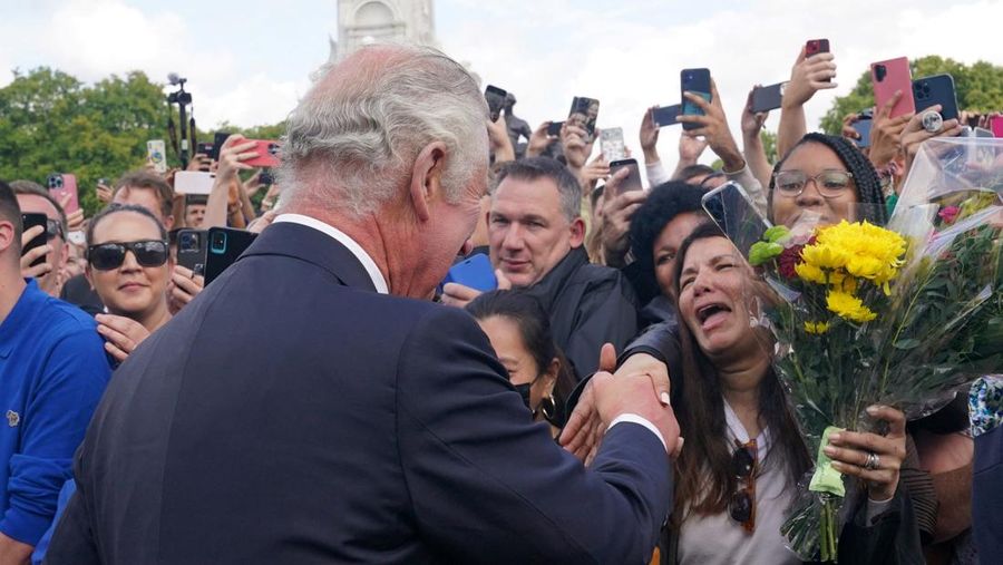 Britain's King Charles and Queen Camilla walk outside Buckingham Palace, following the passing of Britain's Queen Elizabeth, in London, Britain, September 9, 2022. REUTERS/Henry Nicholls