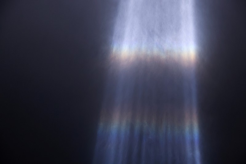 A person looks toward the Tribute in Light for the remembrance of the 21st anniversary of the September 11, 2001 attacks in Manhattan, New York City, U.S., September 11, 2022.  REUTERS/Andrew Kelly