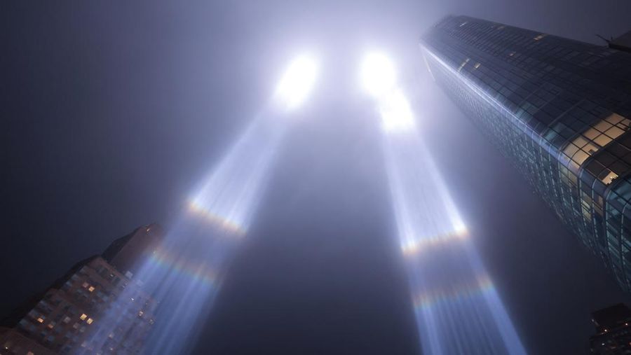A person looks toward the Tribute in Light for the remembrance of the 21st anniversary of the September 11, 2001 attacks in Manhattan, New York City, U.S., September 11, 2022.  REUTERS/Andrew Kelly