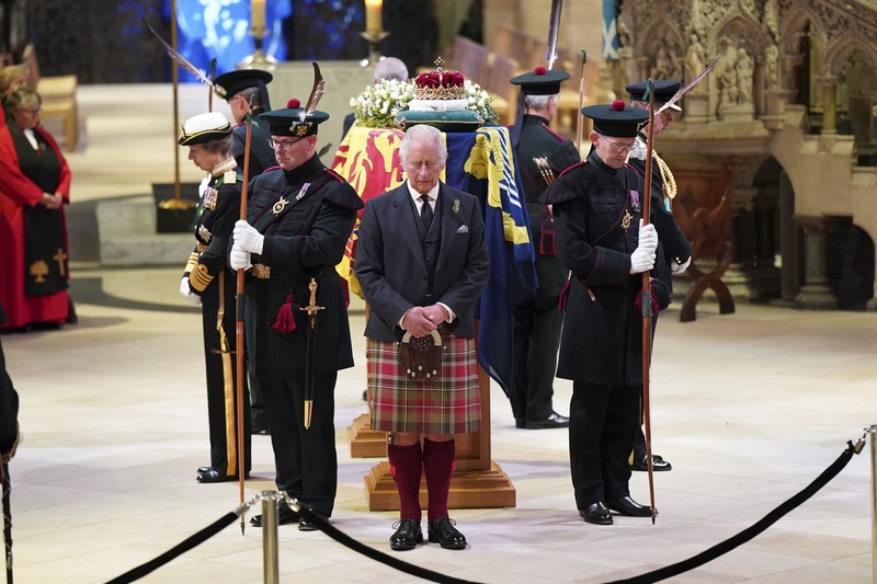 Britain Royals Britain's King Charles III, center, and other members of the royal family hold a vigil at the coffin of Queen Elizabeth II at St Giles' Cathedral, Edinburgh, Scotland, Monday Sept. 12, 2022. (Jane Barlow/Pool via AP)