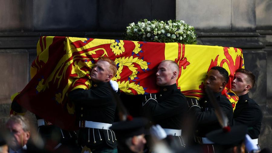 Britain's King Charles III, center, and other members of the royal family hold a vigil at the coffin of Queen Elizabeth II at St Giles' Cathedral, Edinburgh, Scotland,  Monday Sept. 12, 2022. (Jane Barlow/Pool via AP)