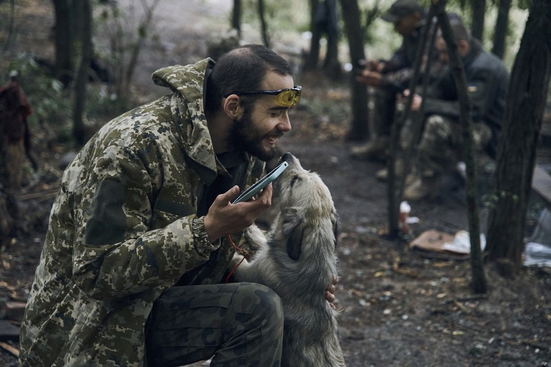 A Ukrainian soldier smiles from a military vehicle on the road in the freed territory in the Kharkiv region, Ukraine, Monday, Sept. 12, 2022. Ukrainian troops retook a wide swath of territory from Russia on Monday, pushing all the way back to the northeastern border in some places, and claimed to have captured many Russian soldiers as part of a lightning advance that forced Moscow to make a hasty retreat. (AP Photo/Kostiantyn Liberov)