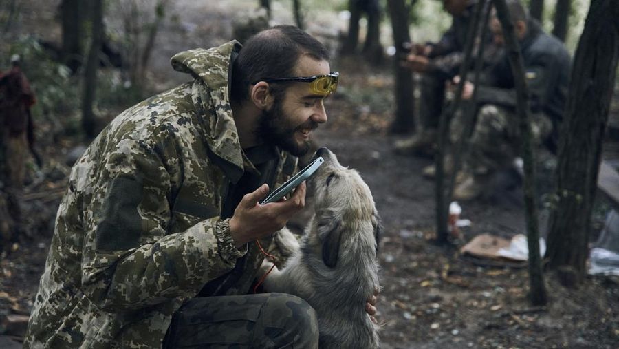A Ukrainian soldier smiles from a military vehicle on the road in the freed territory in the Kharkiv region, Ukraine, Monday, Sept. 12, 2022. Ukrainian troops retook a wide swath of territory from Russia on Monday, pushing all the way back to the northeastern border in some places, and claimed to have captured many Russian soldiers as part of a lightning advance that forced Moscow to make a hasty retreat. (AP Photo/Kostiantyn Liberov)