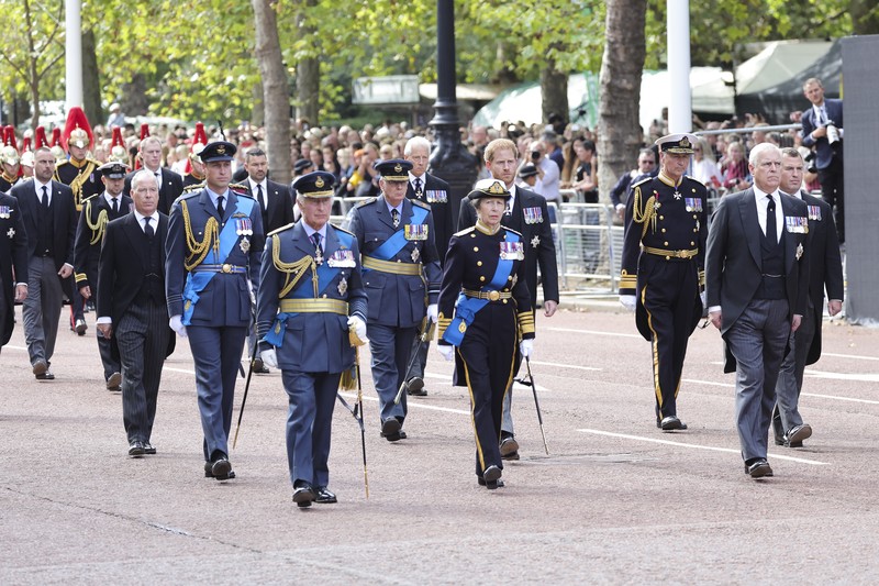 LONDON, ENGLAND - SEPTEMBER 14: David Armstrong-Jones, 2nd Earl of Snowdon, Prince William, Prince of Wales, King Charles III, Anne, Princess Royal, Prince Harry, Duke of Sussex, Timothy Laurence, Prince Andrew, Duke of York and Mr Peter Phillips walk behind the coffin during the procession for the Lying-in State of Queen Elizabeth II on September 14, 2022 in London, England. Queen Elizabeth II's coffin is taken in procession on a Gun Carriage of The King's Troop Royal Horse Artillery from Buckingham Palace to Westminster Hall where she will lay in state until the early morning of her funeral. Queen Elizabeth II died at Balmoral Castle in Scotland on September 8, 2022, and is succeeded by her eldest son, King Charles III.  (Photo by Chris Jackson/Getty Images)