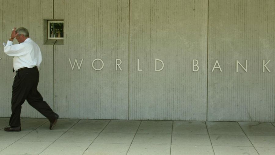 405655 01: A man walks past the front of the World Bank building May 21, 2002 in Washington, DC. Preliminary tests at the World Bank detected possible anthrax contamination on the bank's mail. The World Bank has been regularly testing its mail for anthrax and a field test of some mail came back positive a day before. (Photo by Mark Wilson/Getty Images)