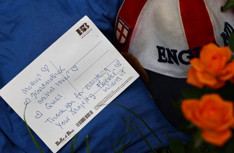 BRITAIN-ROYALS/QUEEN A combination of pictures shows handwritten and drawn tribute messages in respect for Britain's Queen Elizabeth, following her death, at Green Park in London, Britain September 15, 2022. REUTERS/Kai Pfaffenbach