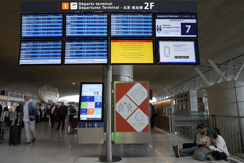 France Airport Strike A traveler pulls her trolley Friday, Sept. 16, 2022 at Roissy Charles de Gaulle airport, north of Paris. Many domestic and some international flights were canceled in France Friday as air traffic controllers went on a national strike over pay and recruitment issues. French civil aviation authority DGAC warned that domestic traffic would be