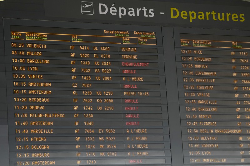 A traveler pulls her trolley Friday, Sept. 16, 2022 at Roissy Charles de Gaulle airport, north of Paris. Many domestic and some international flights were canceled in France Friday as air traffic controllers went on a national strike over pay and recruitment issues. French civil aviation authority DGAC warned that domestic traffic would be 