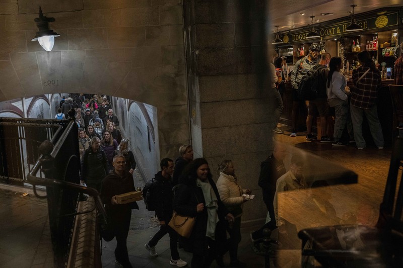 People queue in front of Tower Bridge to pay their respect to the late Queen Elizabeth II during the Lying-in State at Westminster Hall in London, early Saturday morning, Sept. 17, 2022. The Queen will lie in state in Westminster Hall for four full days before her funeral on Monday Sept. 19. (AP Photo/Martin Meissner)