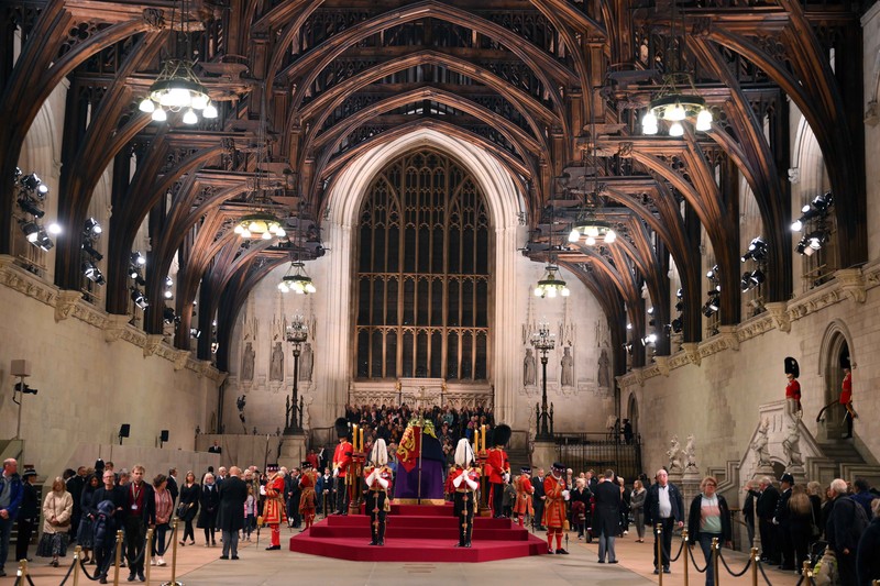People queue in front of Tower Bridge to pay their respect to the late Queen Elizabeth II during the Lying-in State at Westminster Hall in London, early Saturday morning, Sept. 17, 2022. The Queen will lie in state in Westminster Hall for four full days before her funeral on Monday Sept. 19. (AP Photo/Martin Meissner)