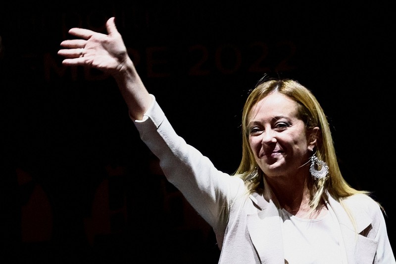 Giorgia Meloni Leader of Brothers of Italy Giorgia Meloni holds a sign at the party's election night headquarters, in Rome, Italy September 26, 2022. REUTERS/Guglielmo Mangiapane TPX IMAGES OF THE DAY