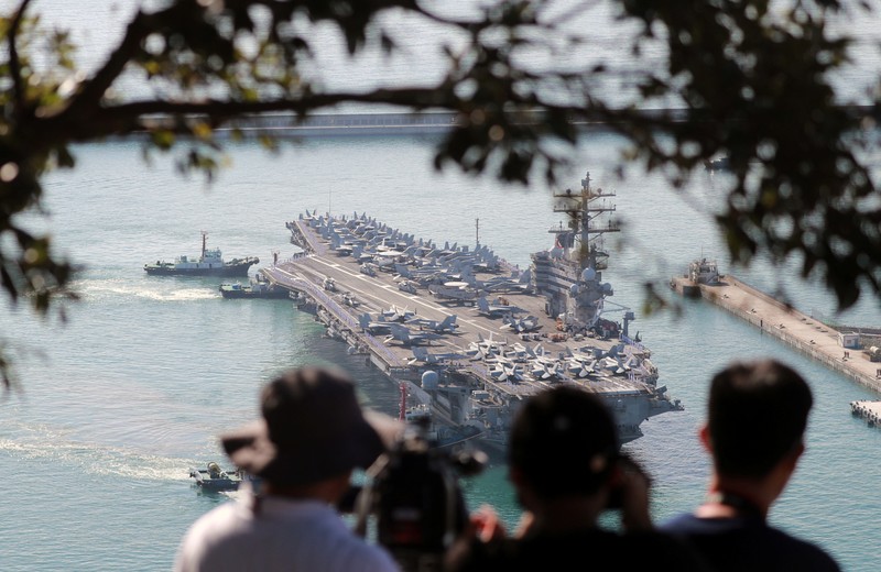 Kapal induk Angkatan Laut AS USS Ronald Reagan berlabuh di sebuah pelabuhan di Busan, Korea Selatan Kapal induk Angkatan Laut AS USS Ronald Reagan berlabuh di sebuah pelabuhan di Busan, Korea Selatan, Jumat (23/9/2022). (REUTERS/Daewoung Kim)