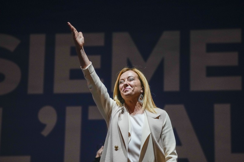 Giorgia Meloni Leader of Brothers of Italy Giorgia Meloni holds a sign at the party's election night headquarters, in Rome, Italy September 26, 2022. REUTERS/Guglielmo Mangiapane TPX IMAGES OF THE DAY
