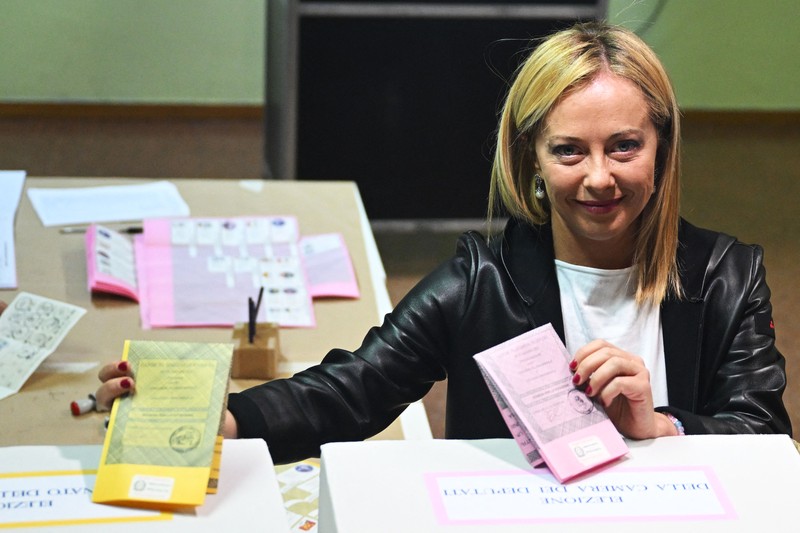Giorgia Meloni Leader of Brothers of Italy Giorgia Meloni holds a sign at the party's election night headquarters, in Rome, Italy September 26, 2022. REUTERS/Guglielmo Mangiapane TPX IMAGES OF THE DAY