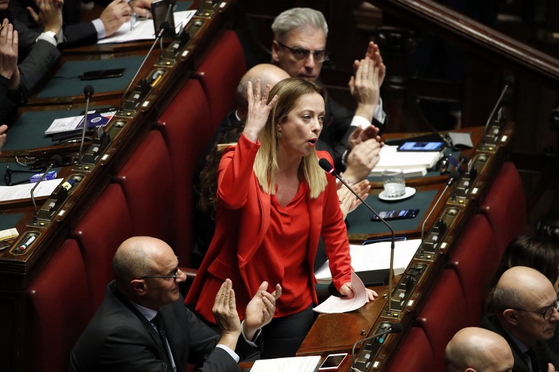 Giorgia Meloni Leader of Brothers of Italy Giorgia Meloni holds a sign at the party's election night headquarters, in Rome, Italy September 26, 2022. REUTERS/Guglielmo Mangiapane TPX IMAGES OF THE DAY