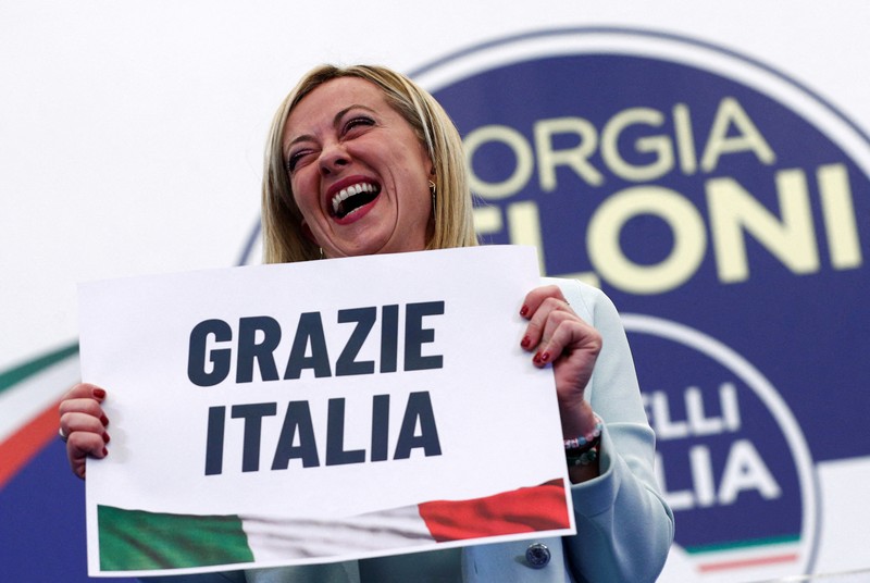 Giorgia Meloni Leader of Brothers of Italy Giorgia Meloni holds a sign at the party's election night headquarters, in Rome, Italy September 26, 2022. REUTERS/Guglielmo Mangiapane TPX IMAGES OF THE DAY