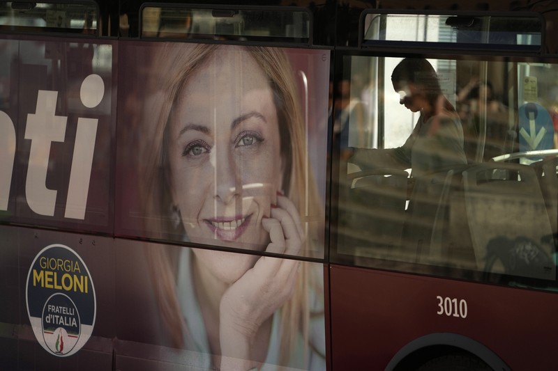 Giorgia Meloni Leader of Brothers of Italy Giorgia Meloni holds a sign at the party's election night headquarters, in Rome, Italy September 26, 2022. REUTERS/Guglielmo Mangiapane TPX IMAGES OF THE DAY