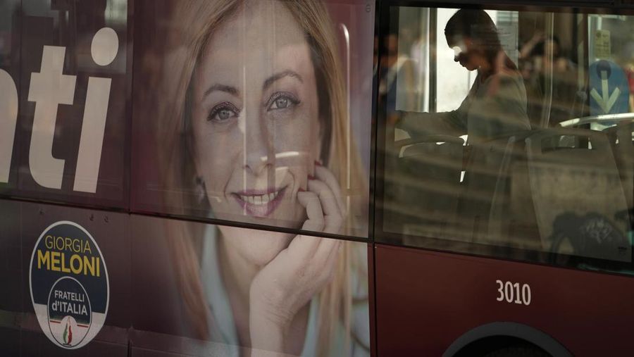 Leader of Brothers of Italy Giorgia Meloni holds a sign at the party's election night headquarters, in Rome, Italy September 26, 2022. REUTERS/Guglielmo Mangiapane     TPX IMAGES OF THE DAY