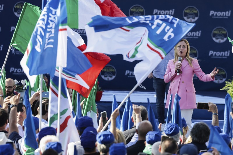 Giorgia Meloni Leader of Brothers of Italy Giorgia Meloni holds a sign at the party's election night headquarters, in Rome, Italy September 26, 2022. REUTERS/Guglielmo Mangiapane TPX IMAGES OF THE DAY