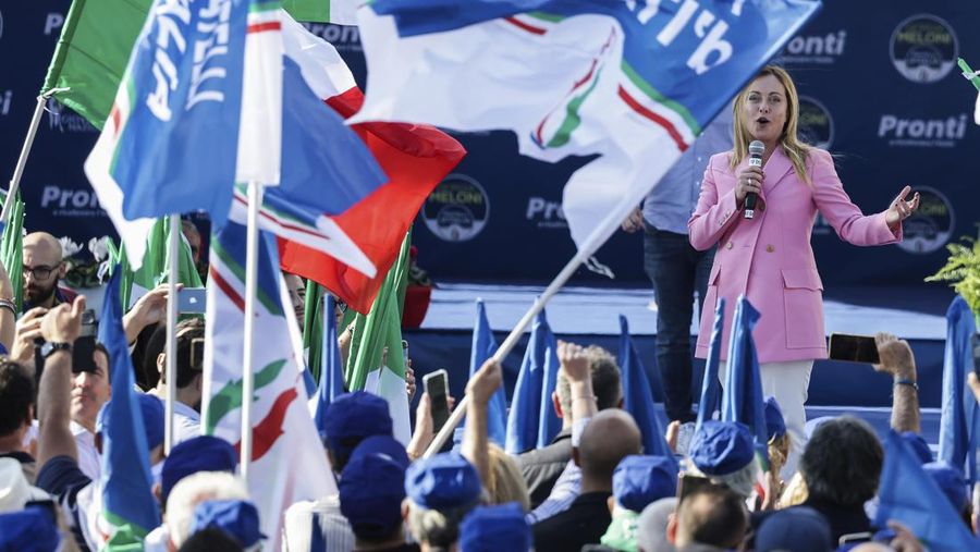 Leader of Brothers of Italy Giorgia Meloni holds a sign at the party's election night headquarters, in Rome, Italy September 26, 2022. REUTERS/Guglielmo Mangiapane     TPX IMAGES OF THE DAY