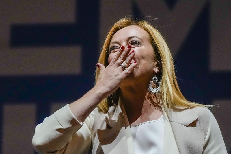 Giorgia Meloni Leader of Brothers of Italy Giorgia Meloni holds a sign at the party's election night headquarters, in Rome, Italy September 26, 2022. REUTERS/Guglielmo Mangiapane TPX IMAGES OF THE DAY