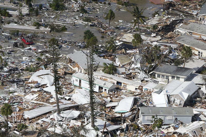 Tropical Weather Damaged homes and debris are shown in the wake of Hurricane Ian, Thursday, Sept. 29, 2022, in Fort Myers Beach, Fla. (AP Photo/Wilfredo Lee)