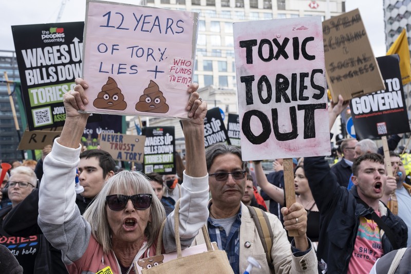 The People's Assembly Against Austerity protest to coincide with the opening of the Conservative Party Conference under the title We Will Not Pay For Their Crisis gathers outside the ICC on 2nd October 2022 in Birmingham, United Kingdom. With the cost of energy bills rising, financial turmoil in the markets following the Chancellors mini-budget, recession in the economy, and the cost of living crisis gripping households all over the country, the Peoples Assembly are holding a series of protests to unite workers and communities from all over Britain against the Tory government, and their policies. Thousands of protesters gathered holding placards for the demonstration and march. (photo by Mike Kemp/In Pictures via Getty Images)