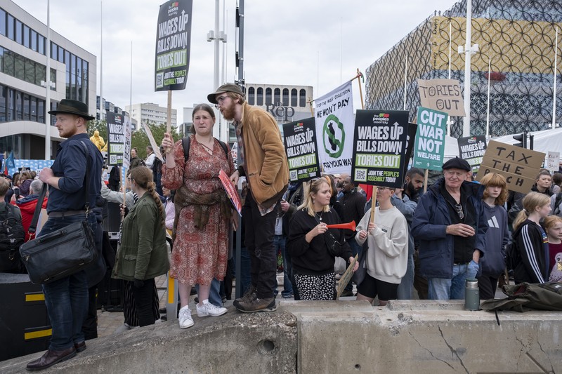 The People's Assembly Against Austerity protest to coincide with the opening of the Conservative Party Conference under the title We Will Not Pay For Their Crisis gathers outside the ICC on 2nd October 2022 in Birmingham, United Kingdom. With the cost of energy bills rising, financial turmoil in the markets following the Chancellors mini-budget, recession in the economy, and the cost of living crisis gripping households all over the country, the Peoples Assembly are holding a series of protests to unite workers and communities from all over Britain against the Tory government, and their policies. Thousands of protesters gathered holding placards for the demonstration and march. (photo by Mike Kemp/In Pictures via Getty Images)