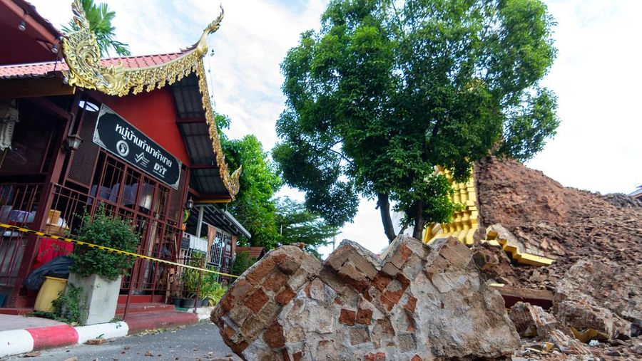 CHIANG MAI, THAILAND - 2022/09/29: A monk inspects the Ancient Buddhist pagoda a 500-year-old Buddhist pagoda at Sri Suphan Temple in Muang district of Chiang Mai that collapsed due to the heavy rains. Ancient Buddhist pagoda at Sri Suphan Temple, collapsed after being worn out by rain throughout the week, prompting officials from the Fine Arts Department to rush to assess the damage. (Photo by Pongmanat Tasiri/SOPA Images/LightRocket via Getty Images)