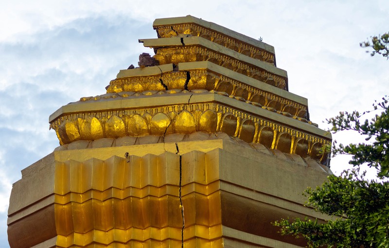 CHIANG MAI, THAILAND - 2022/09/29: A monk inspects the Ancient Buddhist pagoda a 500-year-old Buddhist pagoda at Sri Suphan Temple in Muang district of Chiang Mai that collapsed due to the heavy rains. Ancient Buddhist pagoda at Sri Suphan Temple, collapsed after being worn out by rain throughout the week, prompting officials from the Fine Arts Department to rush to assess the damage. (Photo by Pongmanat Tasiri/SOPA Images/LightRocket via Getty Images)