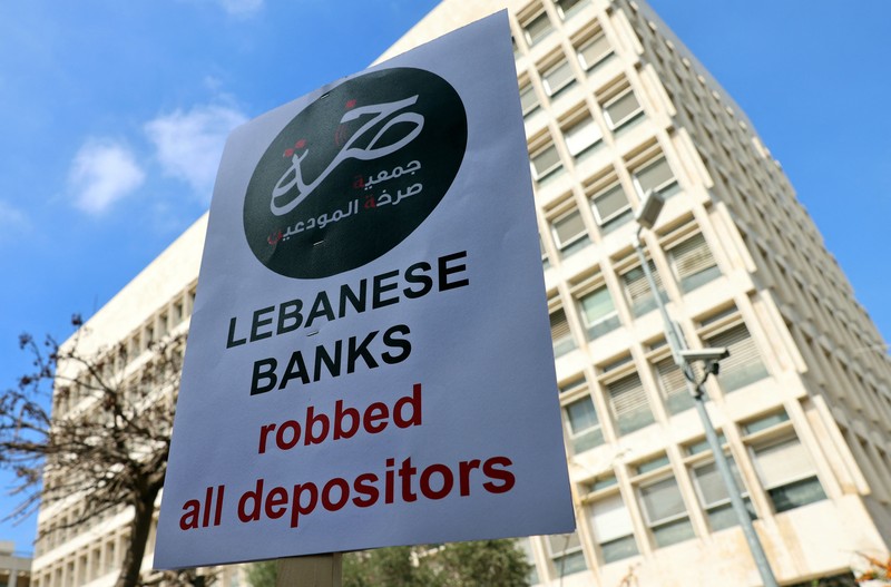Demonstrators carry banners during a protest organised by 