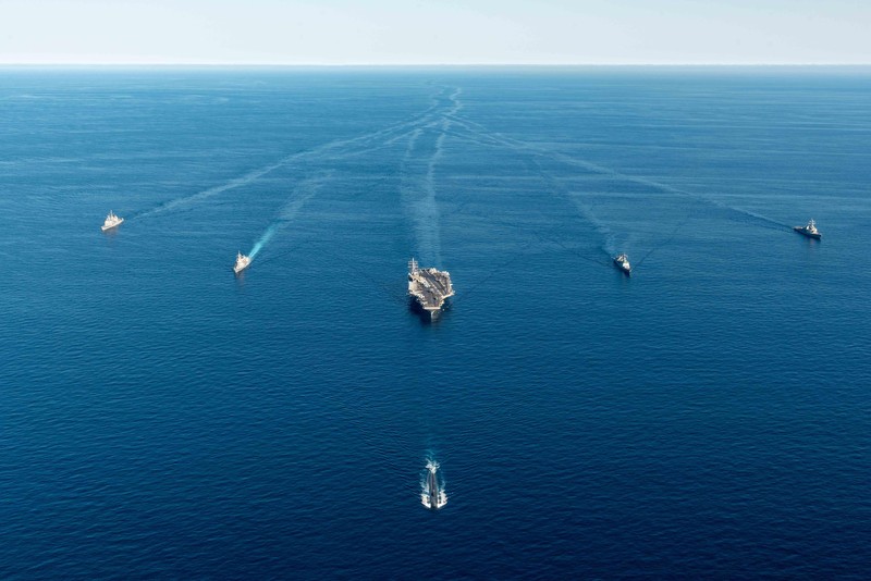 FILE - U.S. aircraft carrier USS Ronald Reagan is escorted into port in Busan, South Korea on Sept. 23, 2022. North Korea launched two short-range ballistic missiles toward its eastern waters Thursday, Oct. 6, 2022. Thursday’s launches came as the U.S. aircraft carrier USS Ronald Reagan returned to waters east of South Korea in what South Korea’s military called an attempt to demonstrate the allies’ 